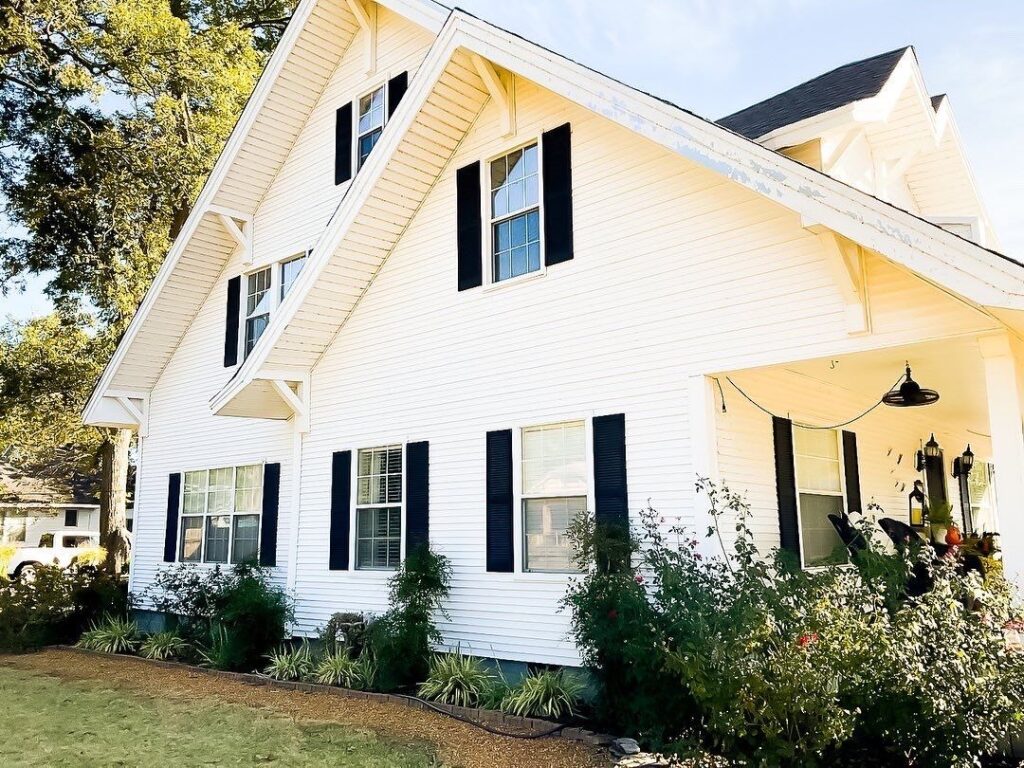 Aerial view of home with shingle roof.