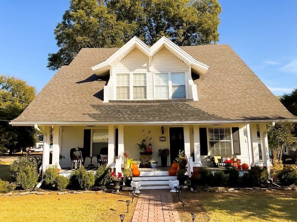 Aerial view of home with shingle roof.